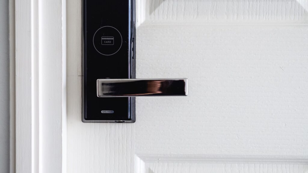 Closeup of door handle with built-in access card reader